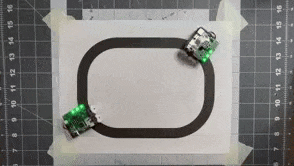 a GIF of two Pocket Bots on a small line-following course