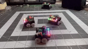 a GIF of several Pocket Bots spinning and flashing their RGB LEDs